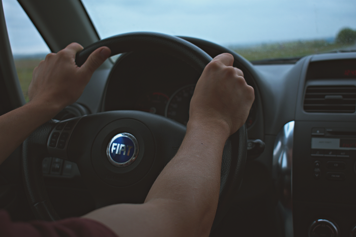 Person driving Fiat vehicle