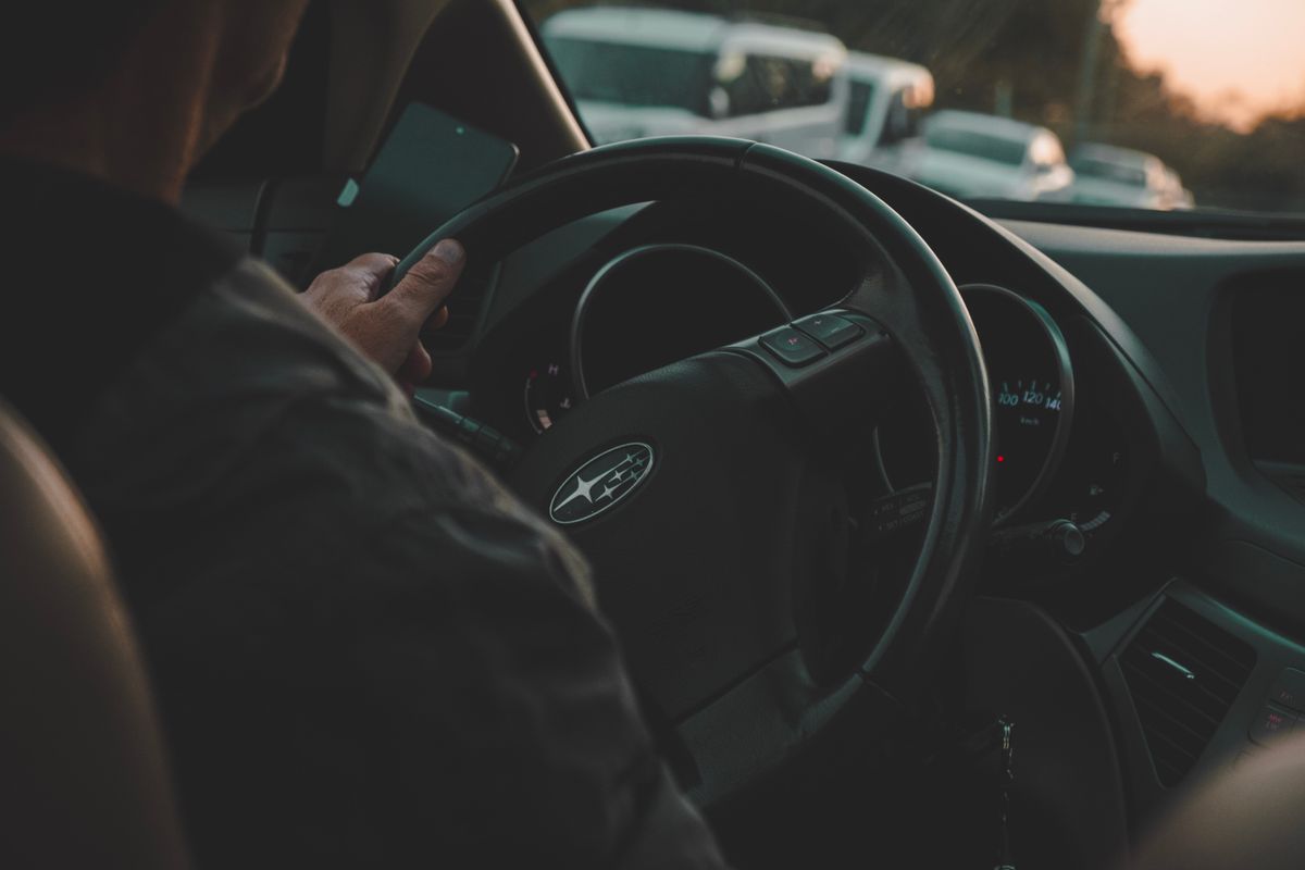 Person driving a car