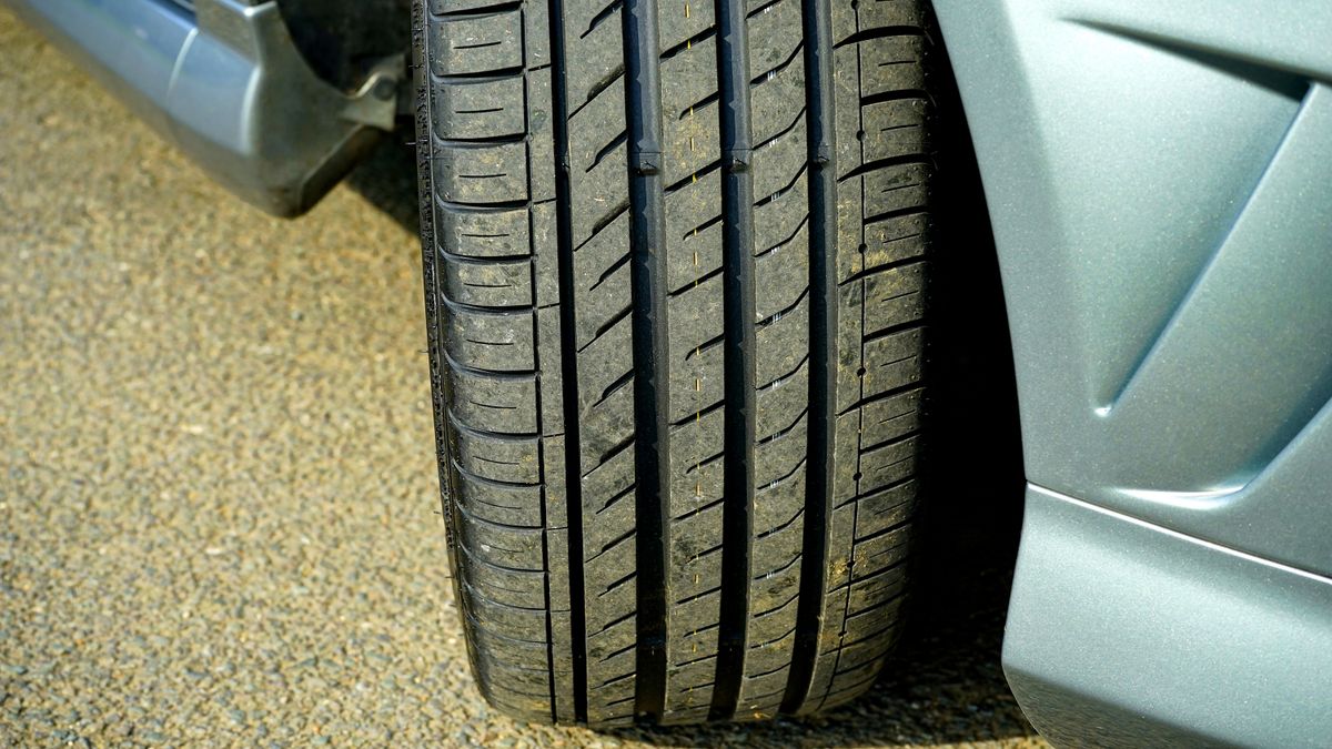 Detailed shot of a car tire on a clean asphalt surface