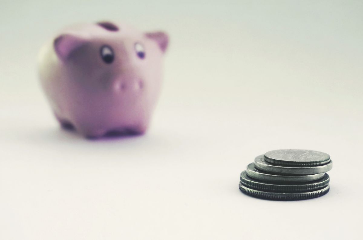 A pink piggy bank blurred in the background