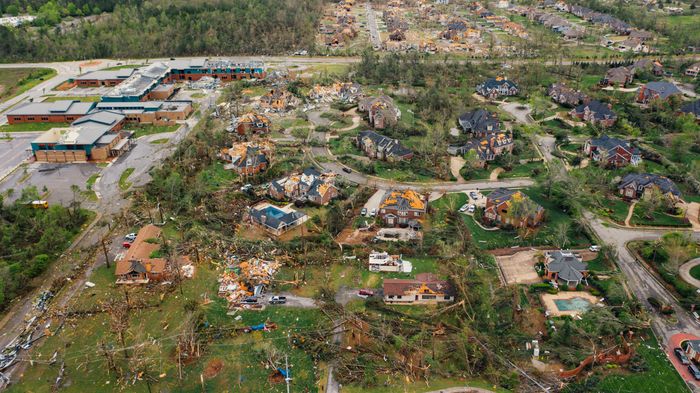 Aerial view of tornado impact on small settlement cottages